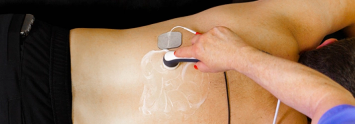 Chiropractic Florence AL Muscle Stimulation Muscle Stimulation on a patient.