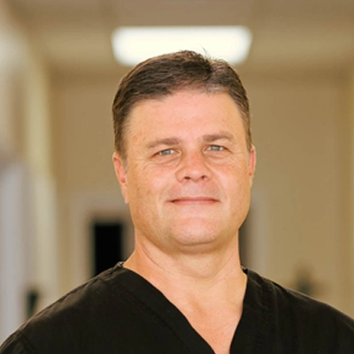 Dr. Charles Corfman smiling.