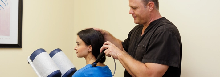 Chiropractor Florence AL Charles Corfman Pro Adjuster Dr. Charles Corfman using the Pro Adjuster on patient.